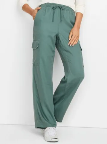 Below the waist shot of women's green cargo pants with drawstring.
