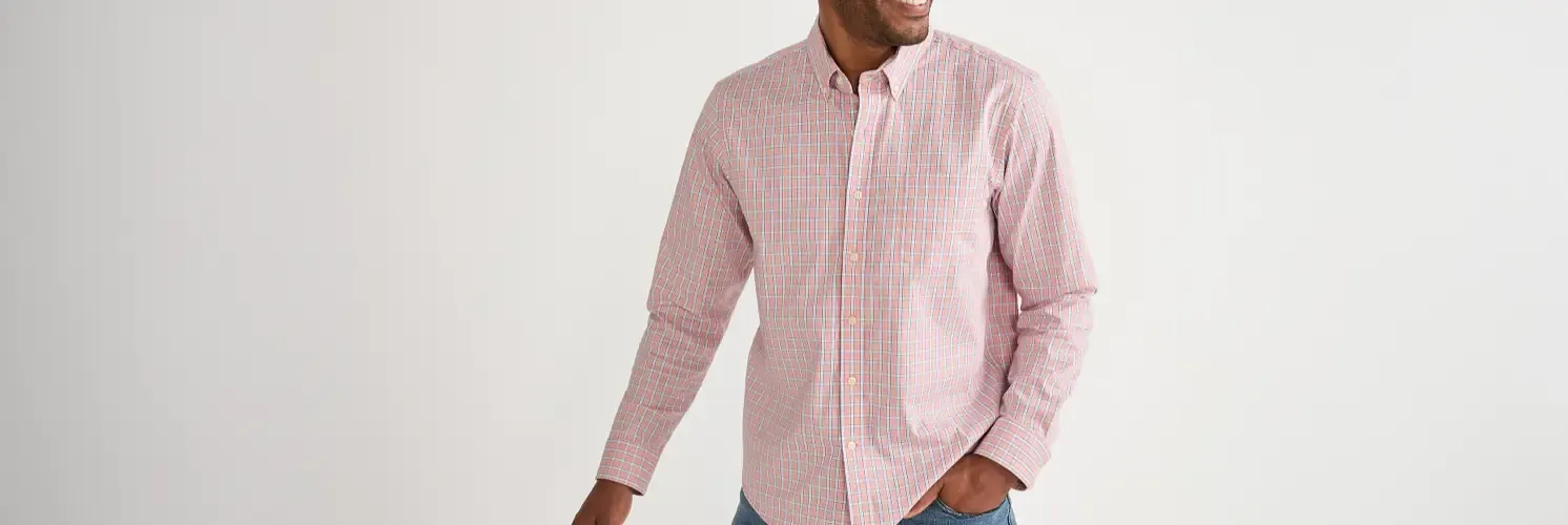 Man wearing a white and pink plaid buttondown shirt.