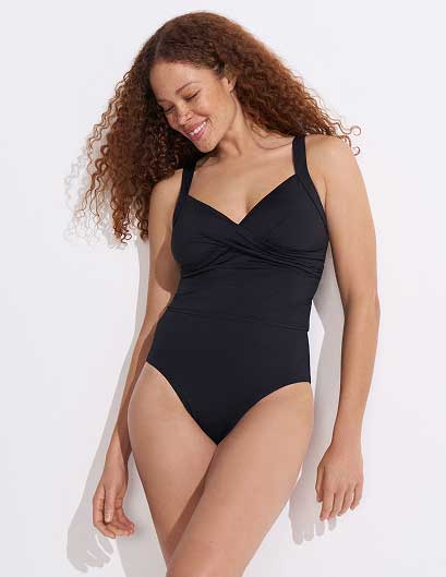 Woman wearing a maximum chest support swimsuit